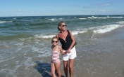 Nina on the beach with Grandma, summer 2013